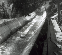 1960's era wooden logging flume with water running in it