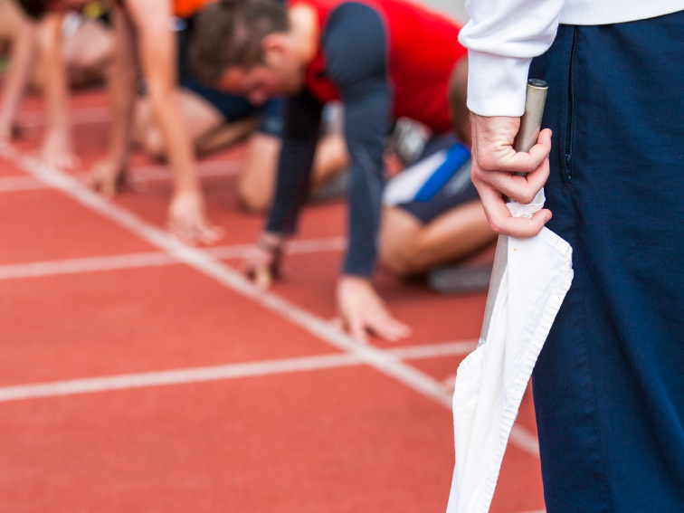 runners at a starting line, waiting for the signal to start